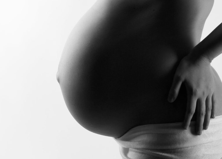 black and white maternity photo with white wrap